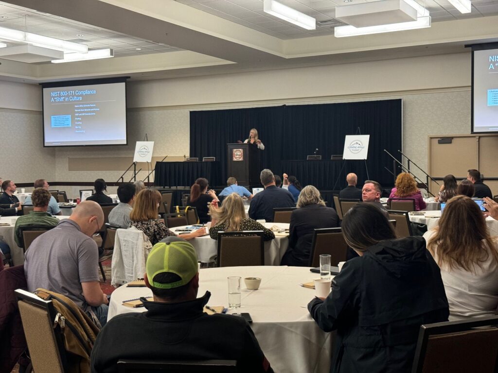 Attendees listening to a session at CMMC-PNW